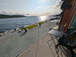 Terrace with sunset views over the fjord in a Type B apartment